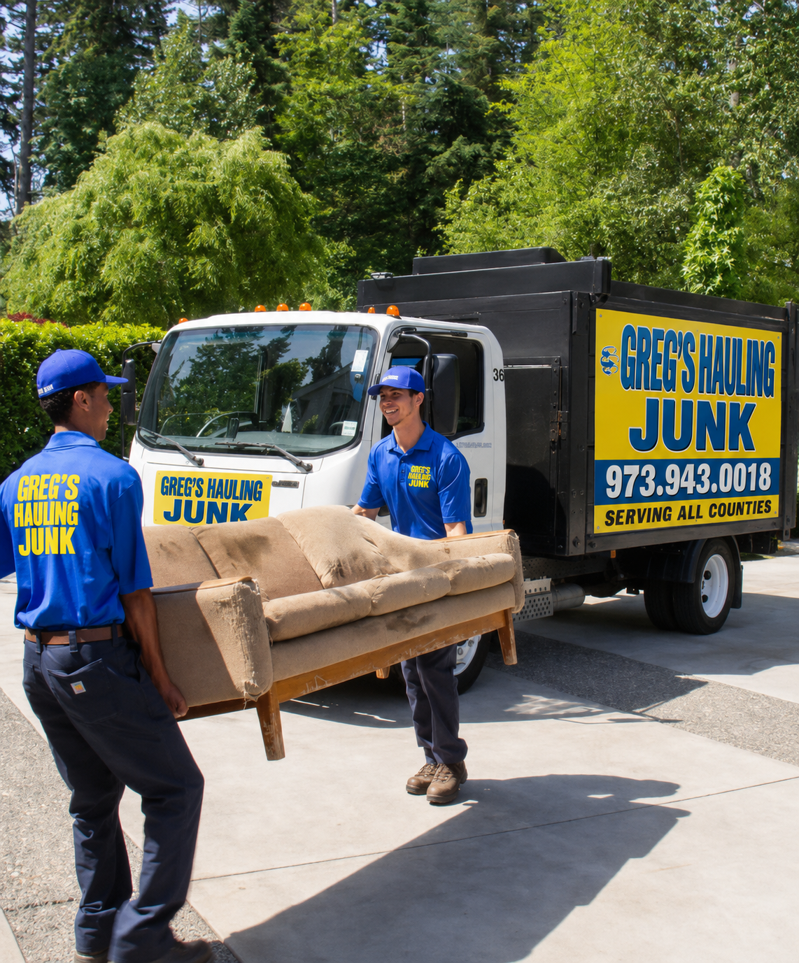 Crew carrying an old sofa out of a New Jersey home during a furniture removal job