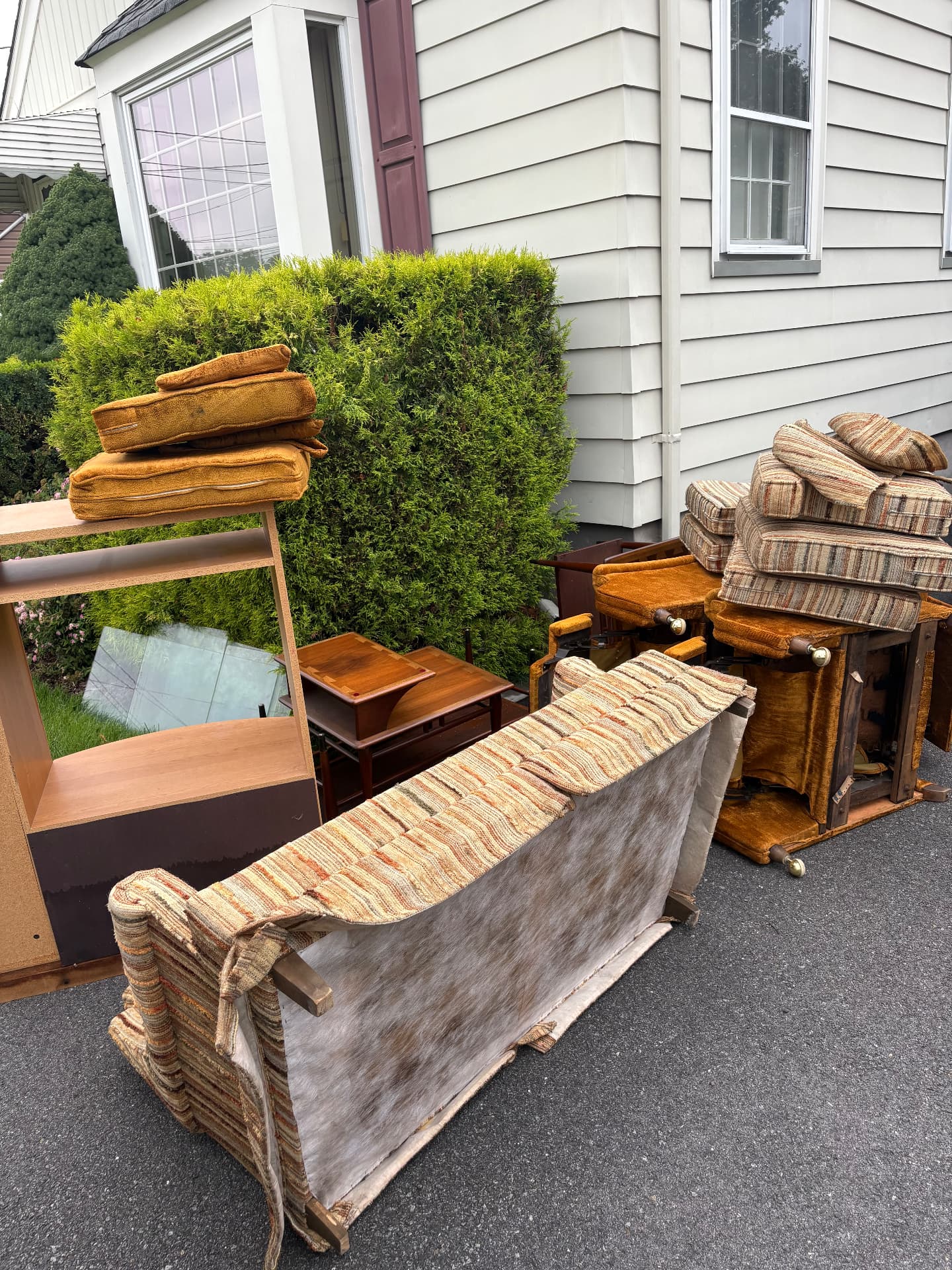 Sofa and household items being cleared during a full house cleanout in New Jersey
