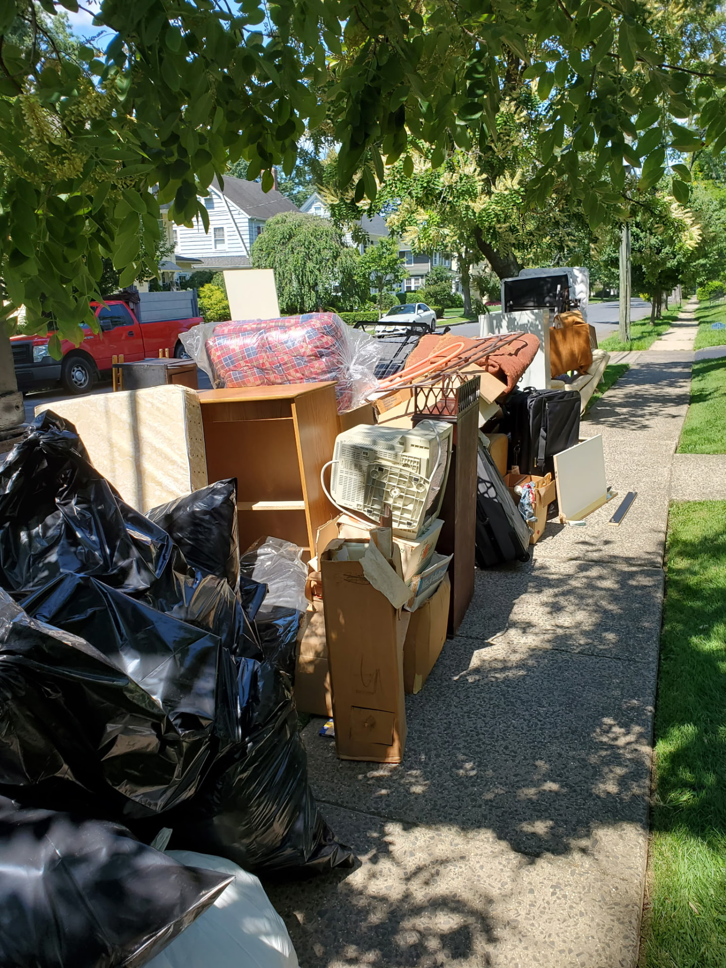 Bagged and boxed belongings staged for removal during an estate cleanout in New Jersey